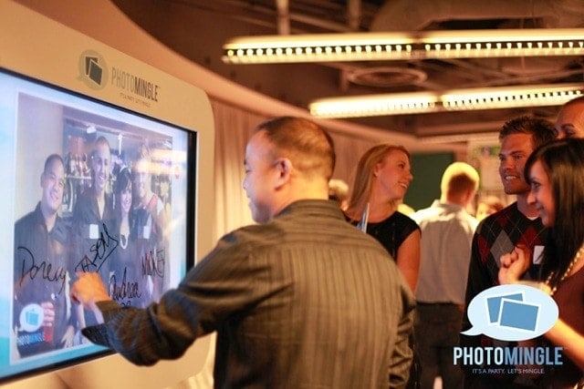 Guests-At-PhotoMingle-Event-Interact-With-Padzilla-Giant-iPad