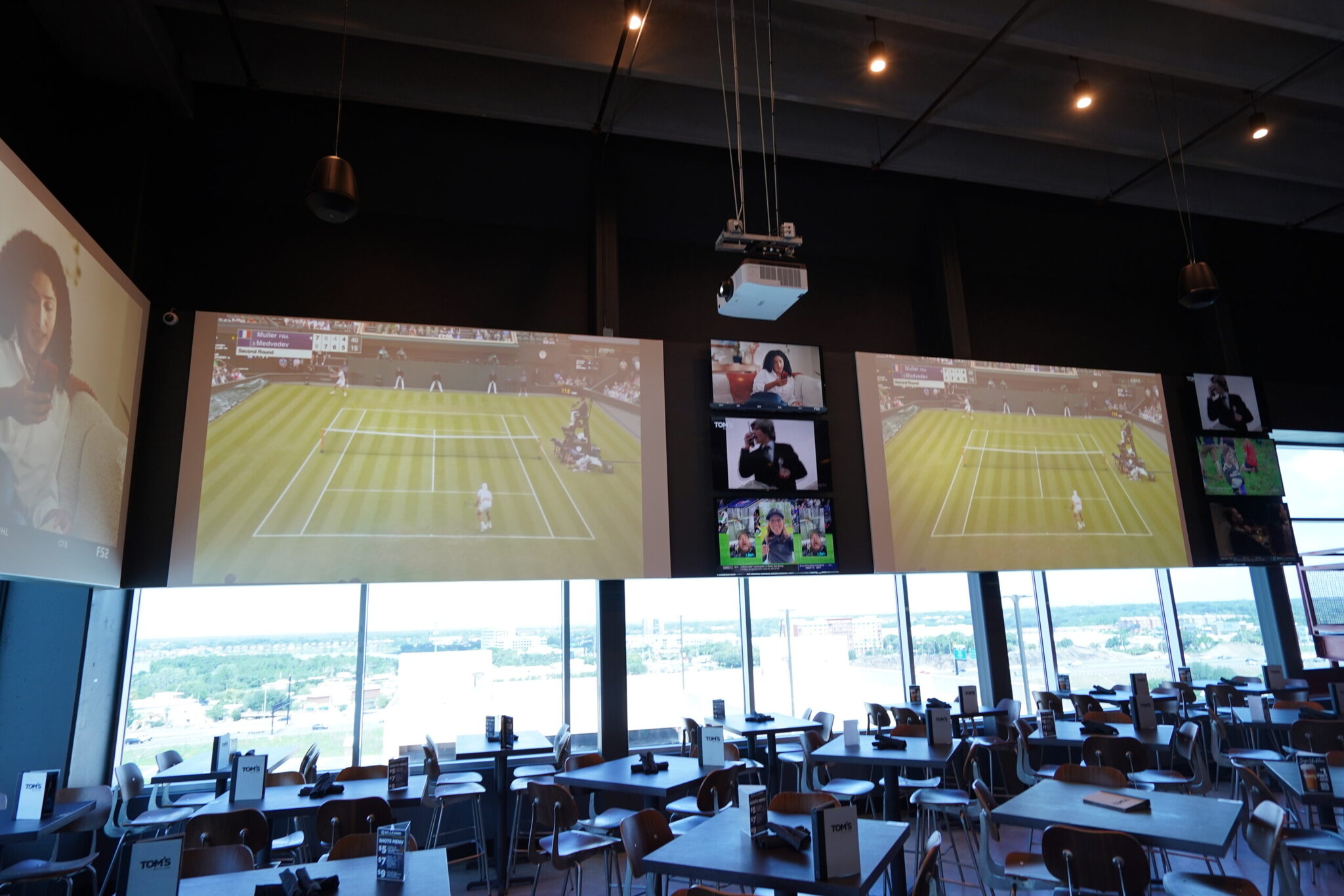 Restaurant with tennis match on big screens