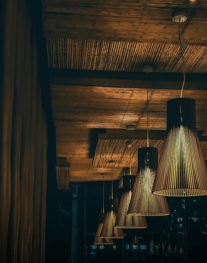Elegant lamps hanging, warm restaurant ambiance