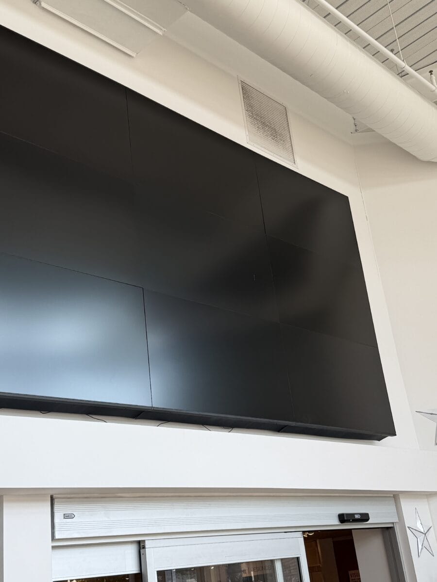 Large black screen above store entrance