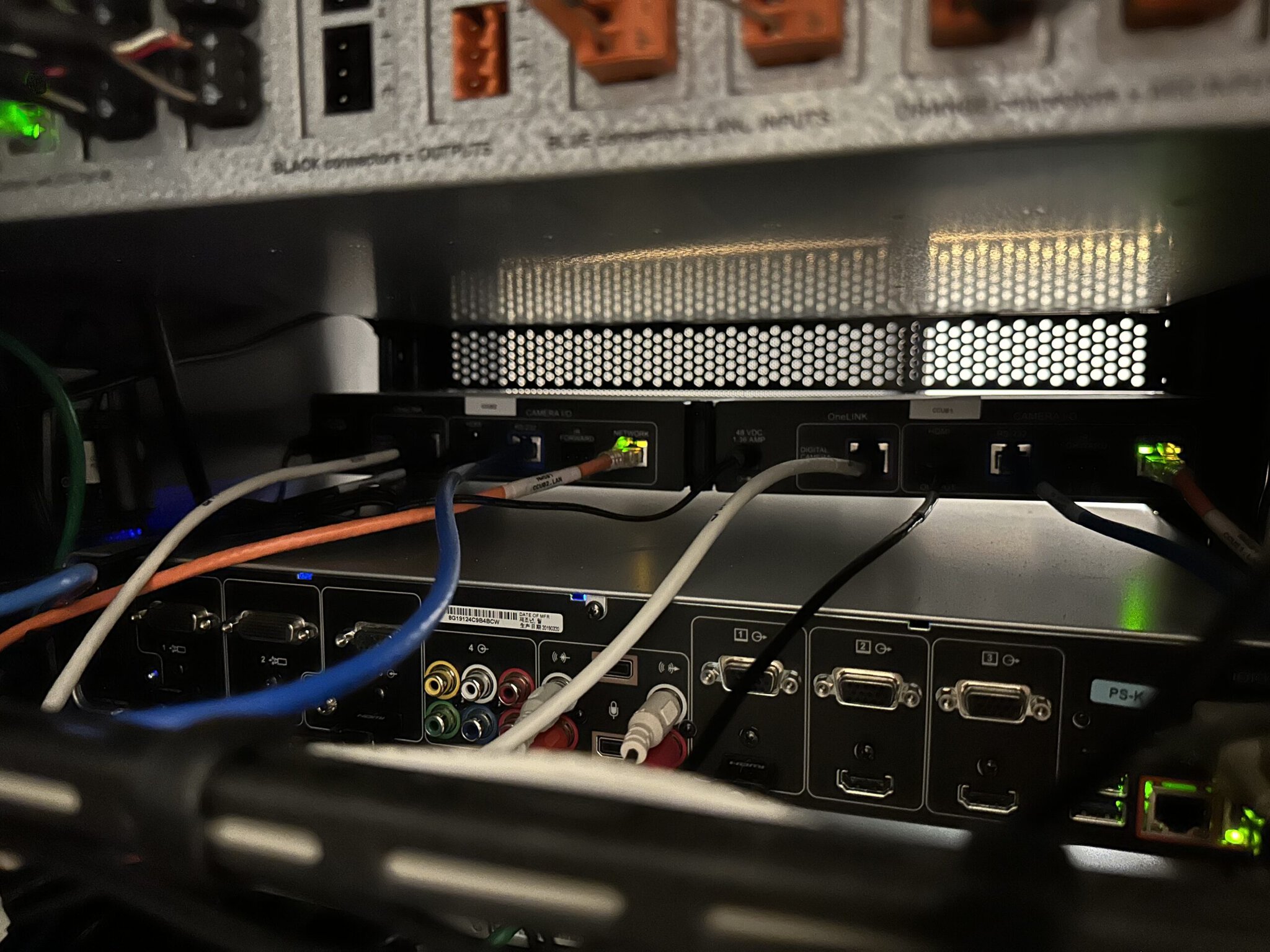 Server rack with various connected cables.