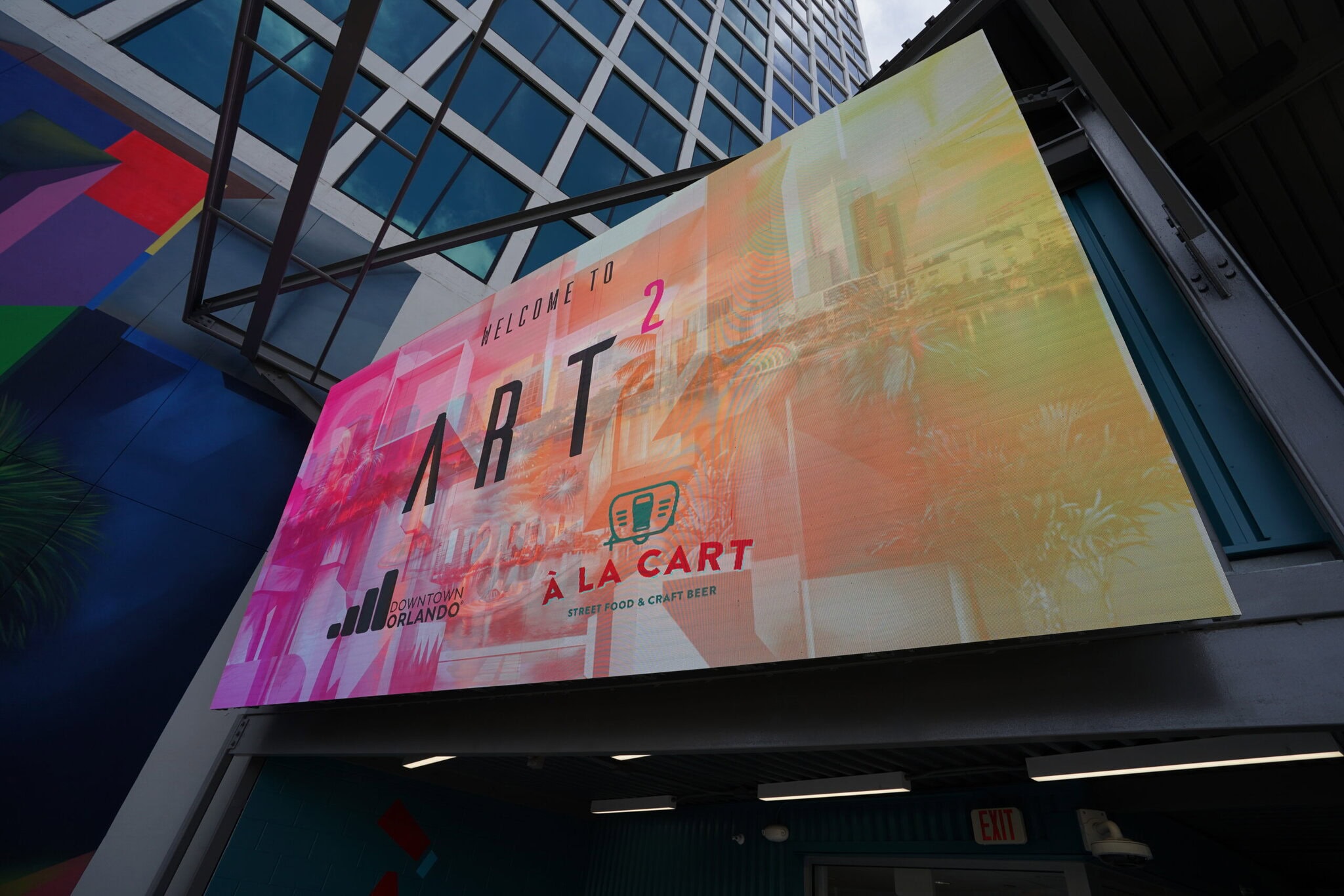 digital signage solutions Colorful ART² sign at Orlando art venue entrance.