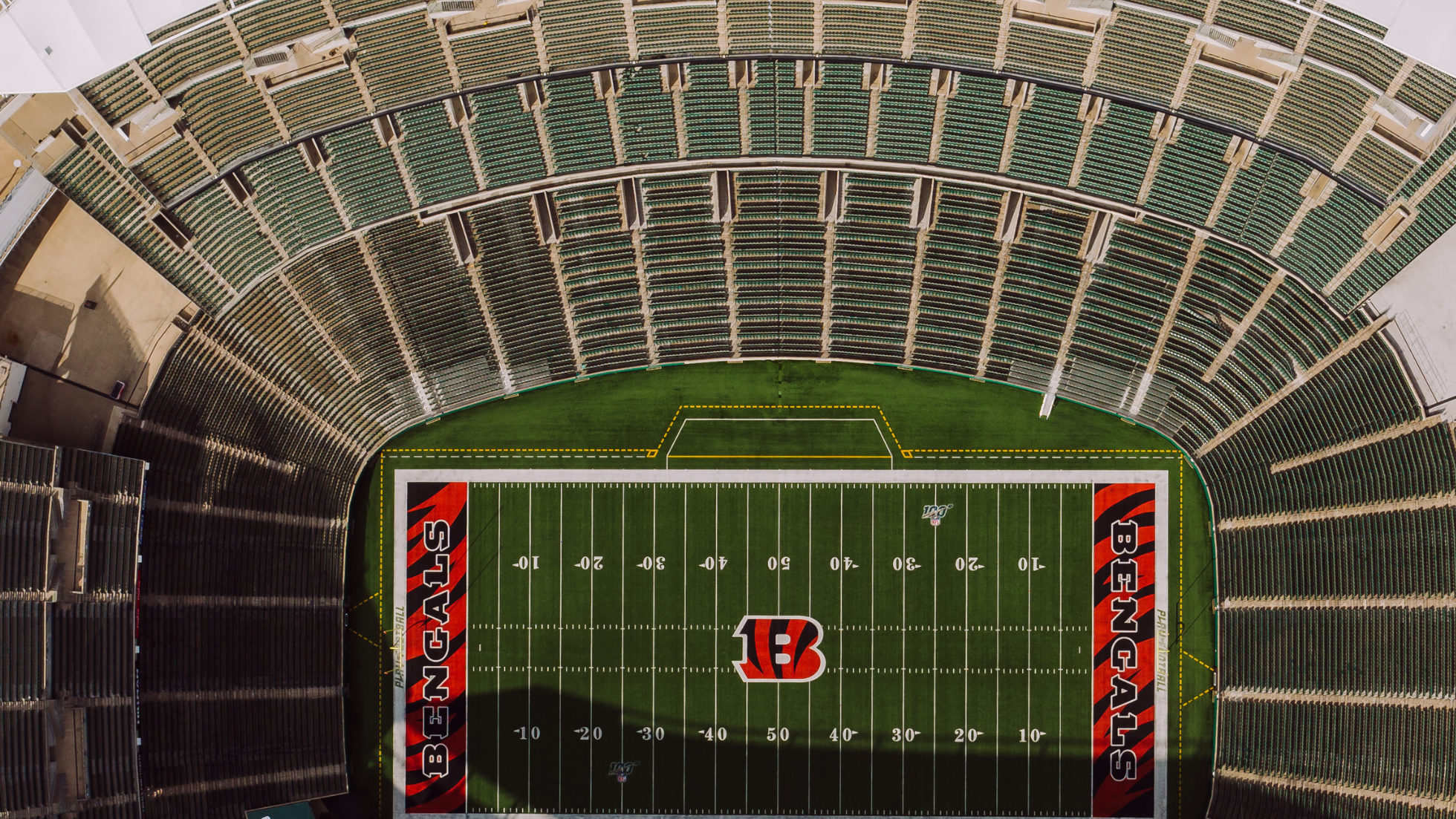 Aerial view of Cincinnati Bengals football stadium with empty green field and surrounding seating sections.